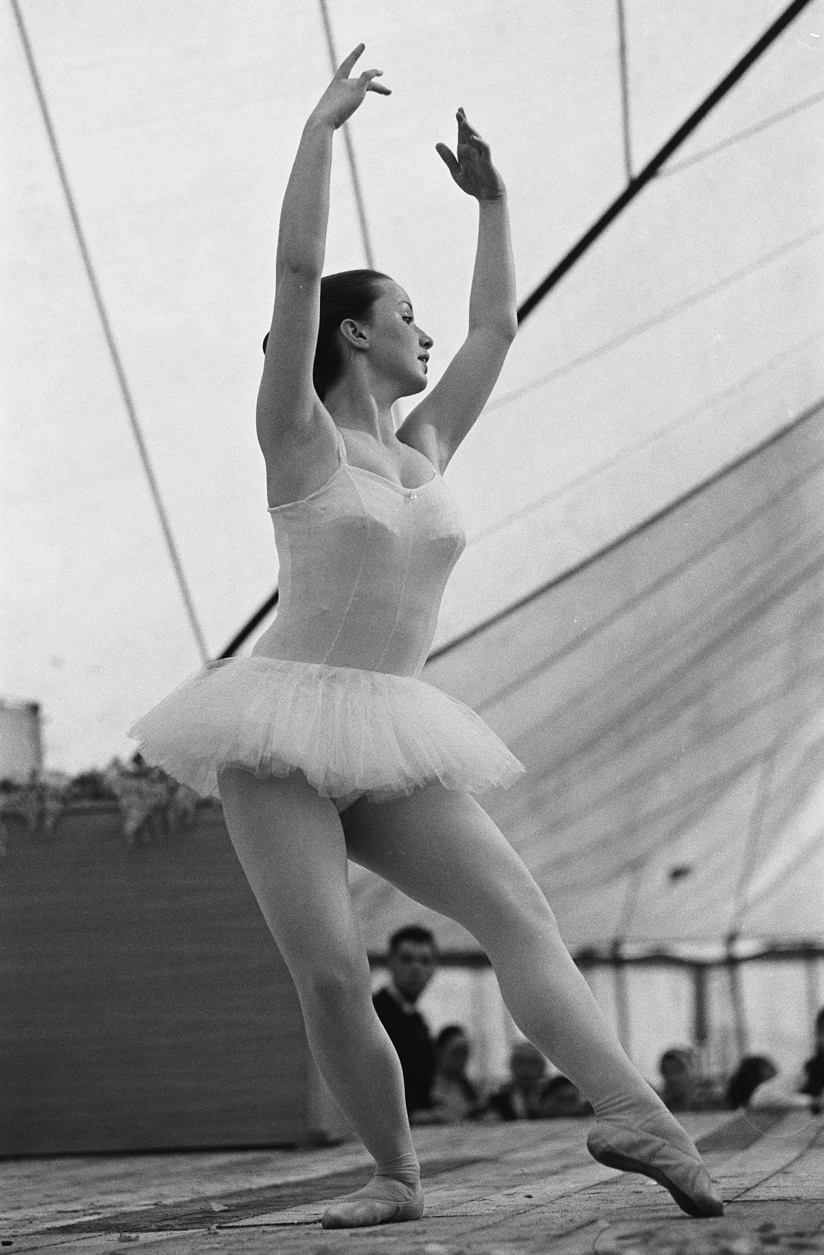 A young ballet dancer on stage at an eisteddfod